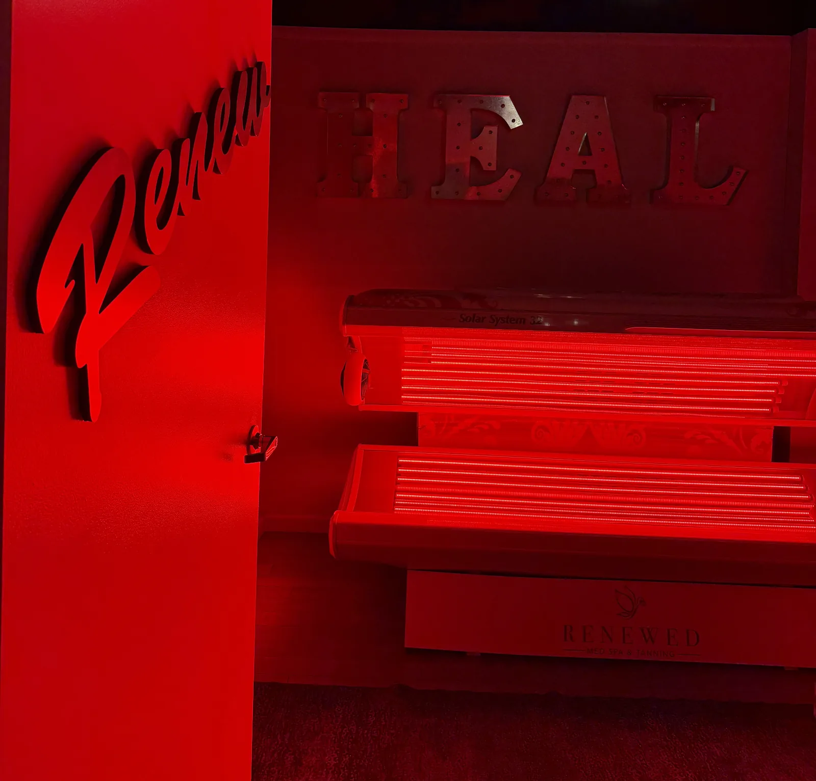 Red light therapy bed in the HEAL room at Renewed Med Spa and Tanning, Glendale AZ